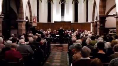 Man sneezes into trombone at concert