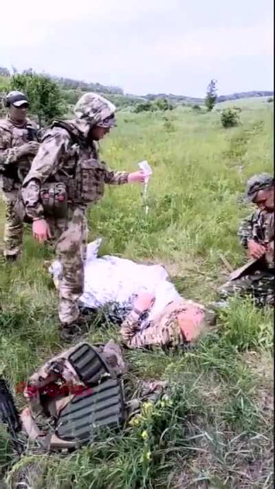 Russians out training field medicine are targeted by cluster munitions.