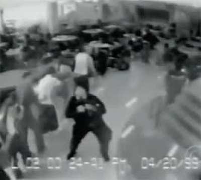 Police evacuating Columbine students through the cafeteria