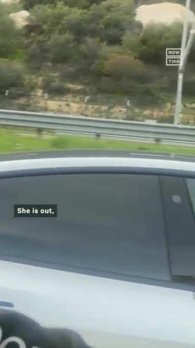 Sleeping woman in traffic using Tesla autopilot