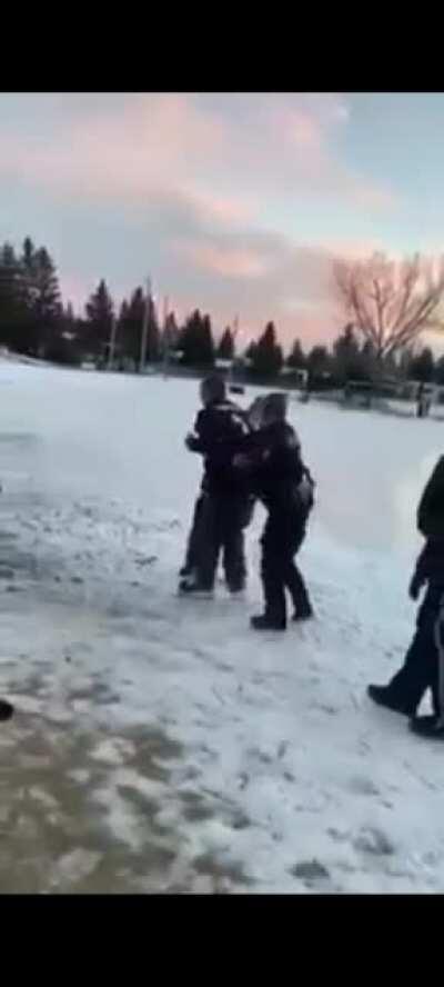 Police in Calgary, Alberta, Canada arrest a man for skating on an outdoor rink