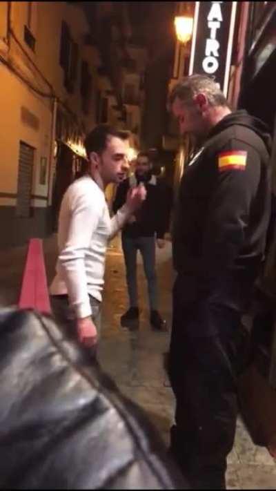 Annoying skinny man gets the shit slapped out of him by spanish bouncer.