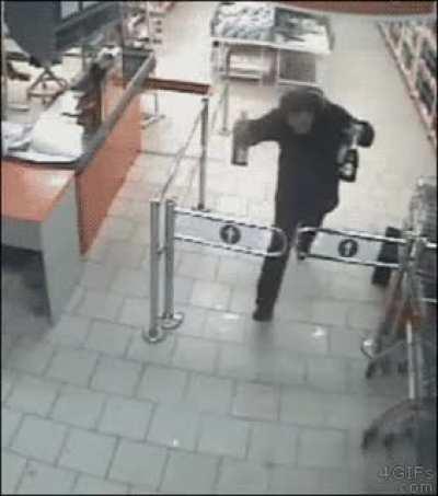 Guy tries to steal bottles of wine