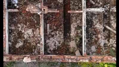 A Ukrainian drone dropping a munition on two Russian soldiers doing illicit activities.