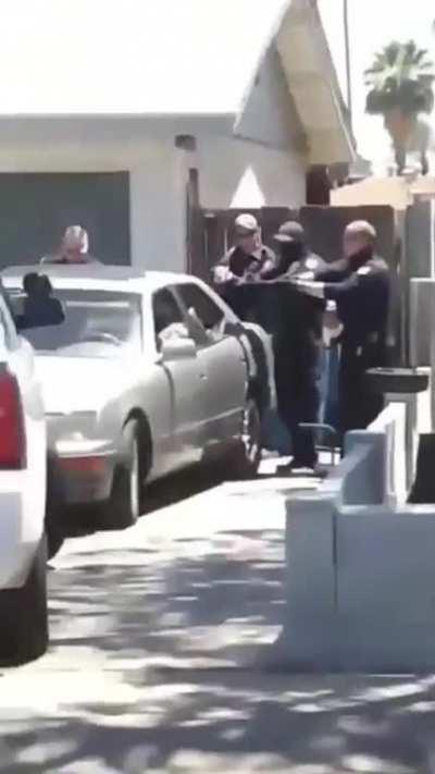 Police shooting into parked car in Phoenix.