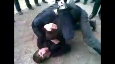 Guy gets face messed up after being caught in a triangle