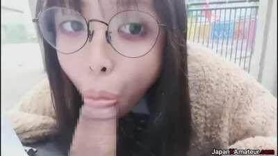 Amateur Japanese Girl With Glasses Deepthroating A Cock In A Park
