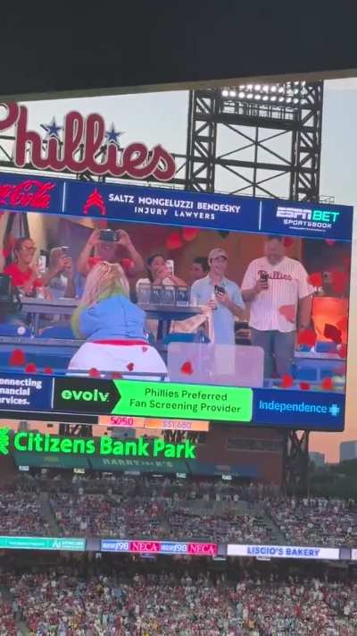 The Phillie Phanatic gets caught in a ColdPlay Kiss Cam moment.