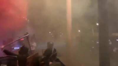 Portland rioters throwing fireworks at the federal courthouse and barricading it with fencing