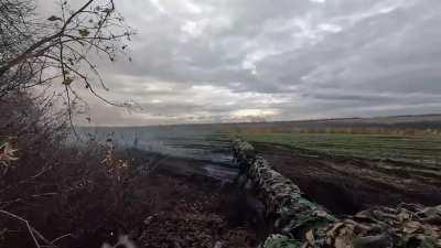 Footage of Ukrainian T-64BV engaging a Russian trenchline across a ridge with direct fire for a bit and then launches smokes to exit the area