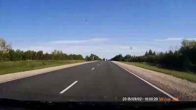 car looses control and crashes into truck. all occupants of the car died instantly