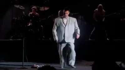 David Byrne of Talking Heads dancing in his oversized suit - from 