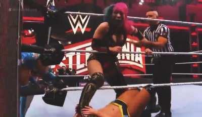 Asuka steps on Alexa’s throat choking her out!