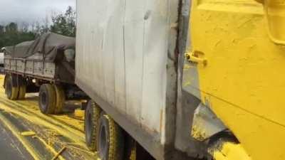 Guy crashes into a paint truck. Gets covered in paint.