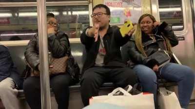 Two people having a civilized conversation on the NYC Subway...