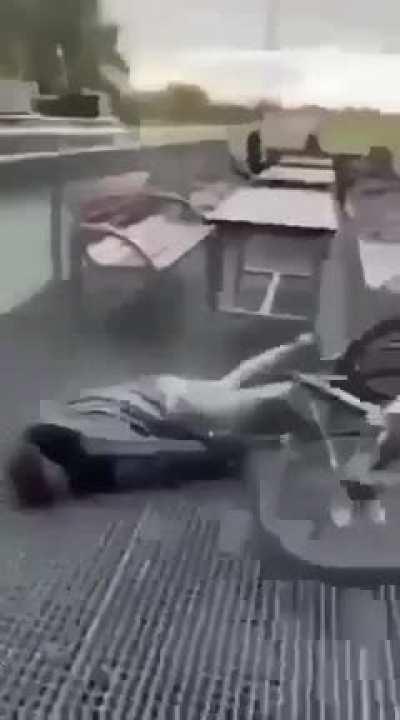 WCGW riding a bike down a table.