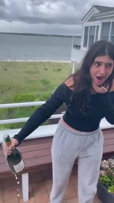 Shaking a bottle of champagne.