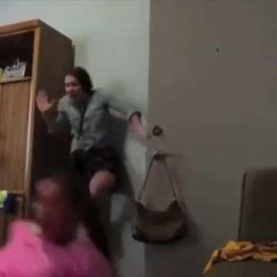 Twerking upside down on door