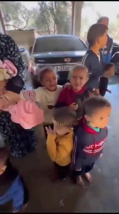 A horrifying scene of Palestinian families with children including infants all sheltering in house shelled, targeted by the genocidal Zionist Occupation forces. Crying terrorised little children along with their mothers. Shells provided by genocide Joe