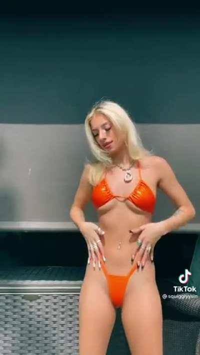Hot blonde in an orange bikini