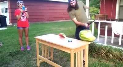 WCGW playing with a machete and a watermelon