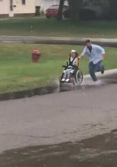 Dad and daughter having fun in the rain.