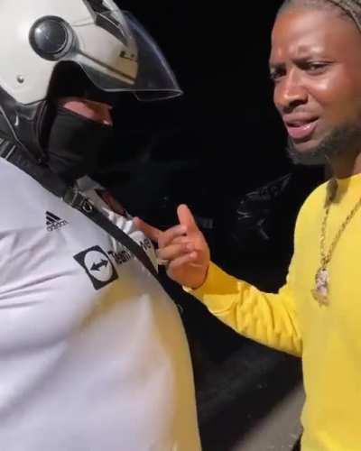 Drillz (51st) approaches Ambush (Buzzworl) behind the scenes in THUG LIFE music video