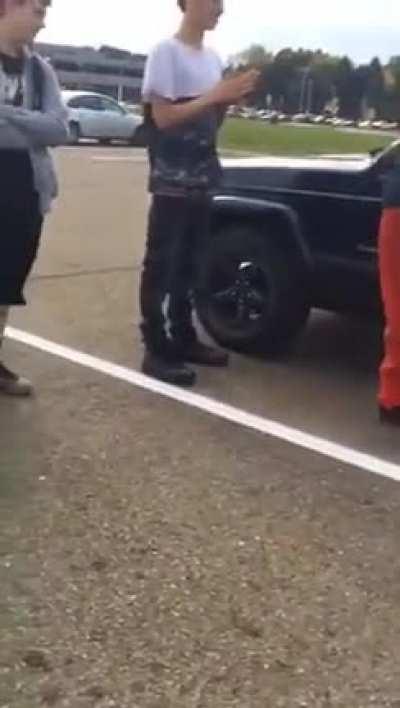 Racist bully gets kicked through glass window