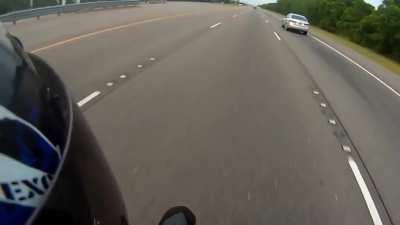 Doing a wheelie in shorts and a tee at high speeds