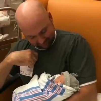 Deaf Father signing to his newborn daughter about how much he loves her