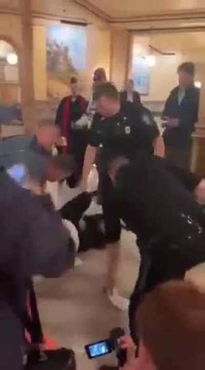 Leader of satan group assaulted and arrested.