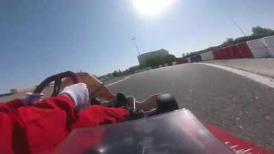 Taking a corner flat out on a dusty track