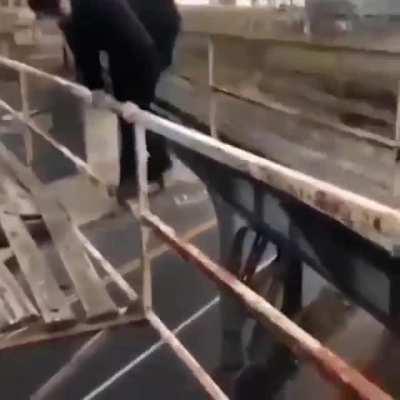Dude plays on a bridge and falls down like Crash Bandicoot