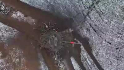 A Ukrainian drone operator from the 46th Airmobile Brigade drops a grenade through the open hatch of a Russian T-80 Obr. 2022. Dnipropetrovsk Oblast, Ukraine, December 2025.