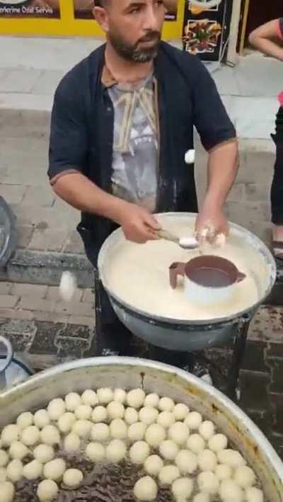 This Turkish street food guy frying up his goods.