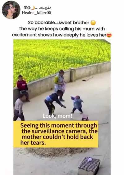 He wants Mum to see that his kid bro can walk by himself. Proud big brother