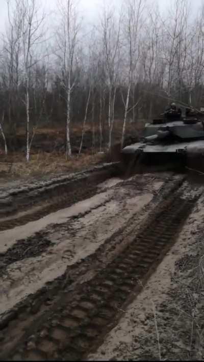 UA POV: An Abrams glides across a muddy road in the Kupyansk direction 