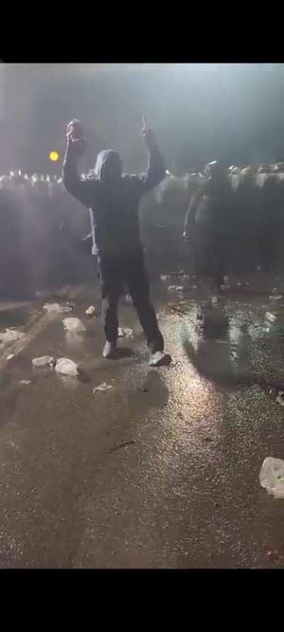 Turkish Police warns the young protestor who is making Ronaldo's goal celebration kindly (!)