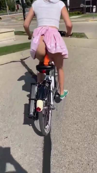 Riding bike with dildo