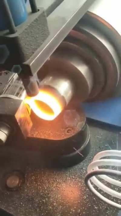 Induction heating and rolling steel tubes