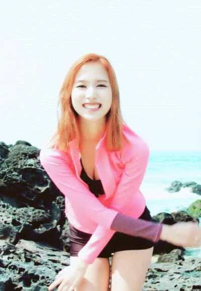 Mina - red hair, pink jacket, black shorts