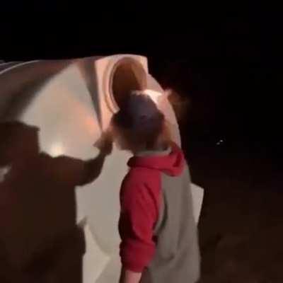 WCGW putting a flaming piece of wood into a mysterious container