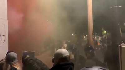 Portland rioters throwing fireworks at the federal courthouse