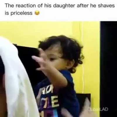 the girls reaction when she looks at her father without beard.