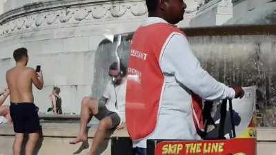 These tourist at the Victor Emmanuel II&rsquo;a monument&rsquo;s fountain in Rome, Italy