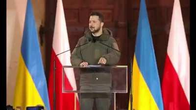 Volodymyr Zelenski takes the floor at Warsaw Royal Castle. 