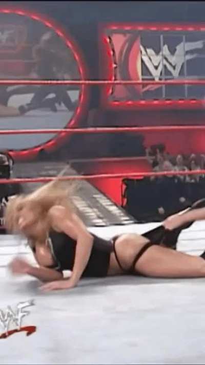 Trish getting her ass spanked in a thong