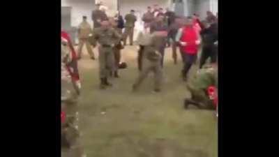 Some Russian military fighting, hard knock out kick.