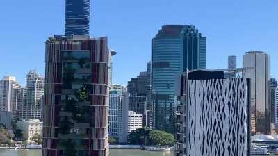 C17 swerves in and out of high rises in Brisbane City