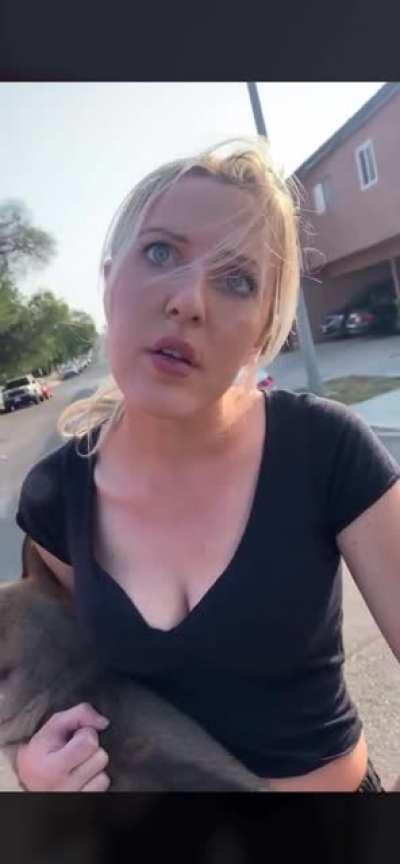 Woman harassing a stranger in the streets. Poor dog...